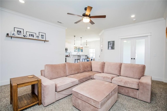 living room with light carpet, recessed lighting, visible vents, and crown molding