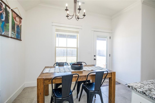 dining room with baseboards, an inviting chandelier, and crown molding