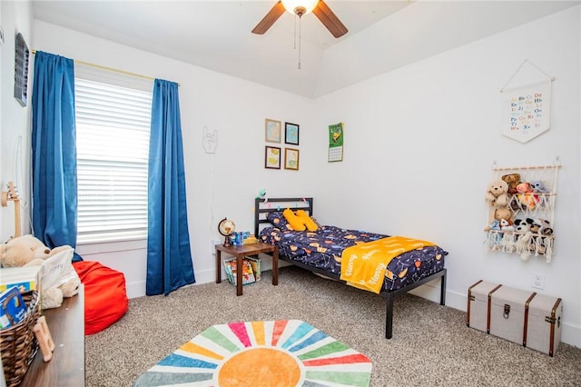 carpeted bedroom featuring ceiling fan and baseboards