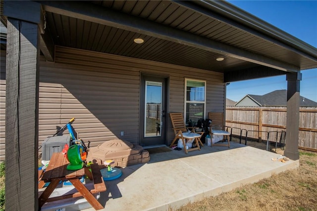 view of patio / terrace featuring fence