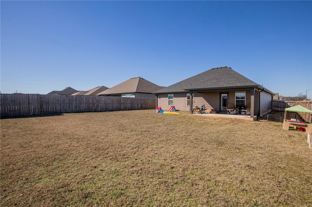 view of yard with a fenced backyard and a patio