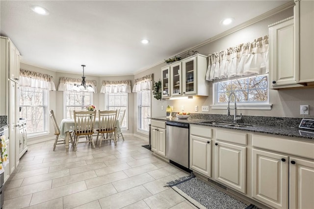 kitchen featuring dishwasher, a sink, glass insert cabinets, and crown molding