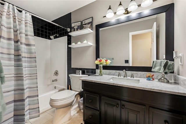 bathroom featuring shower / bath combination with curtain, vanity, toilet, and tile patterned floors