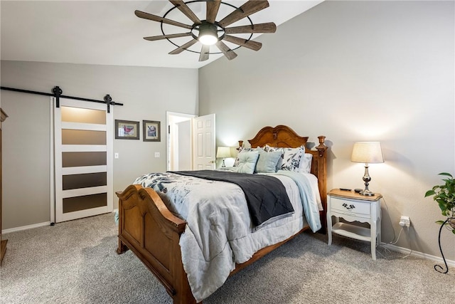 carpeted bedroom featuring a barn door, baseboards, vaulted ceiling, and a ceiling fan