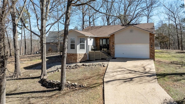 single story home featuring driveway, stone siding, roof with shingles, and an attached garage