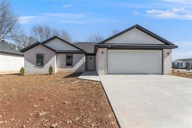 ranch-style home with a garage, concrete driveway, and brick siding