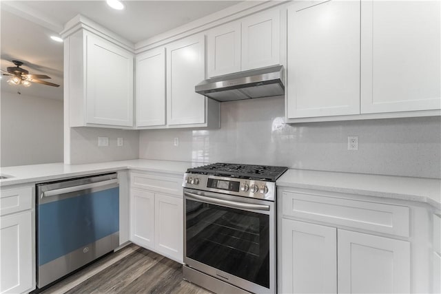 kitchen featuring light countertops, stainless steel gas stove, white cabinetry, under cabinet range hood, and dishwashing machine