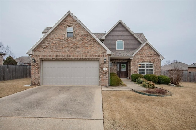 view of front of home featuring roof with shingles, fence, concrete driveway, and brick siding