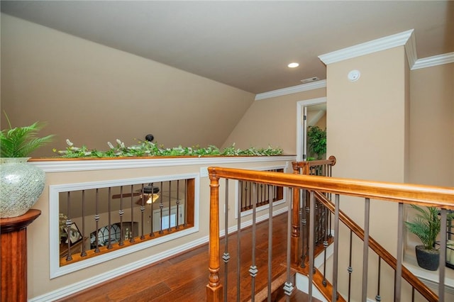 interior space featuring recessed lighting, crown molding, an upstairs landing, and wood finished floors