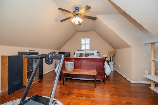 bedroom featuring ceiling fan, baseboards, vaulted ceiling, and wood finished floors