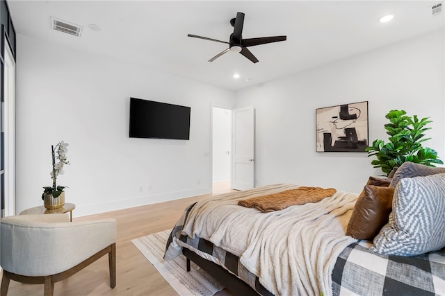 bedroom with baseboards, recessed lighting, visible vents, and light wood-style floors