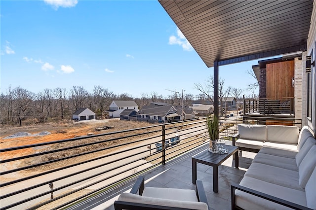 balcony featuring an outdoor hangout area and a residential view