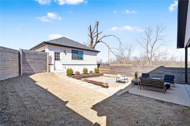 view of yard featuring outdoor lounge area, a patio area, and a fenced backyard