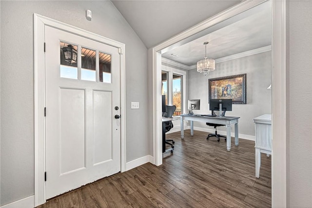 foyer entrance featuring lofted ceiling, dark wood-type flooring, a chandelier, and baseboards