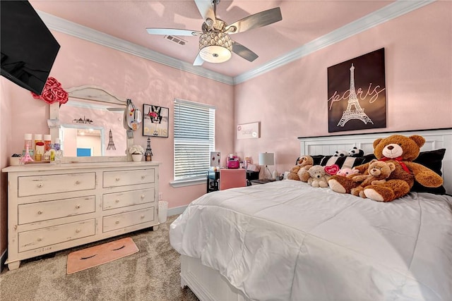 carpeted bedroom featuring baseboards, visible vents, ornamental molding, and a ceiling fan