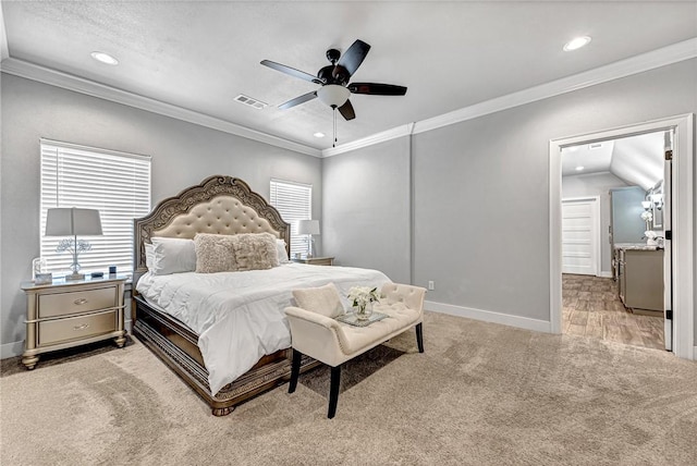 bedroom featuring visible vents, crown molding, and light carpet