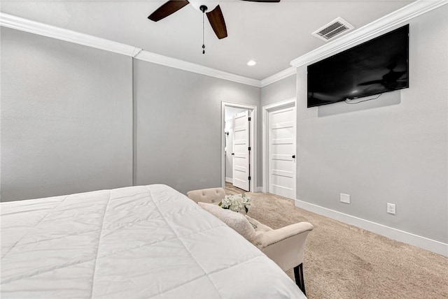 bedroom featuring carpet flooring, visible vents, ceiling fan, baseboards, and ornamental molding