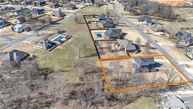 birds eye view of property with a residential view