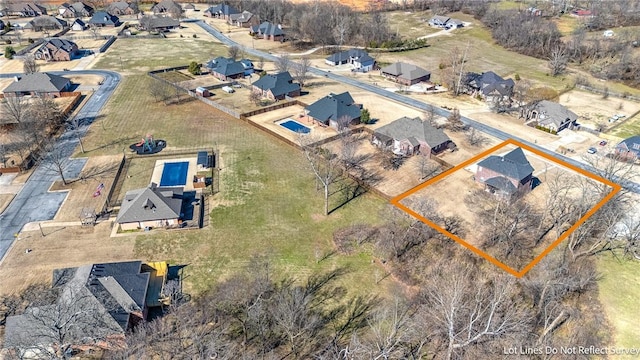 birds eye view of property with a residential view