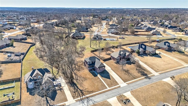 birds eye view of property with a residential view