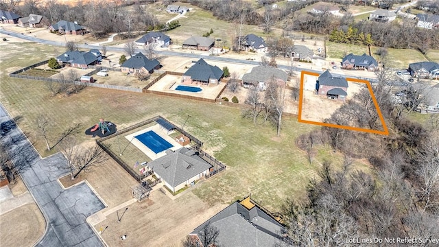 birds eye view of property with a residential view