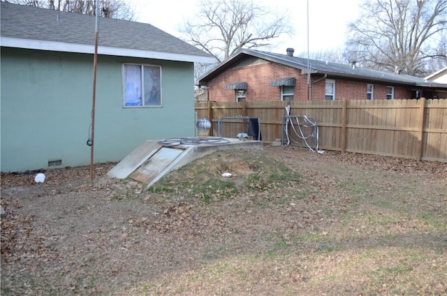 entry to storm shelter with fence