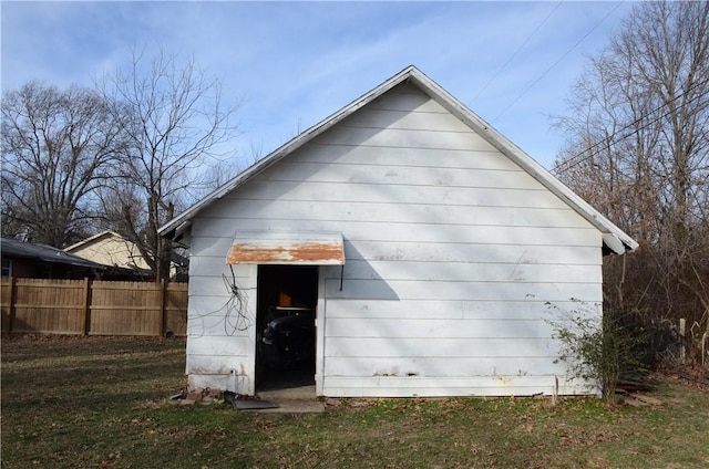 view of outbuilding with fence