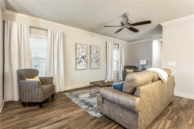 living area featuring baseboards, a ceiling fan, dark wood finished floors, and crown molding