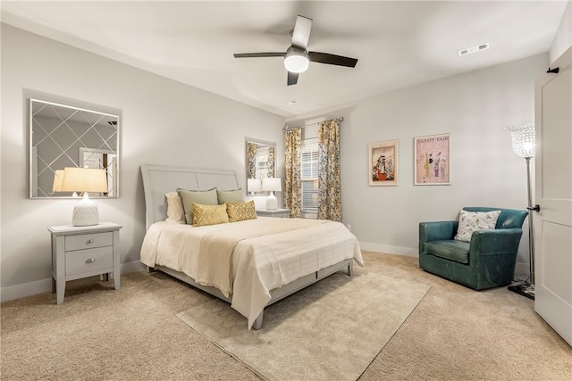 bedroom with baseboards, visible vents, ceiling fan, and carpet flooring