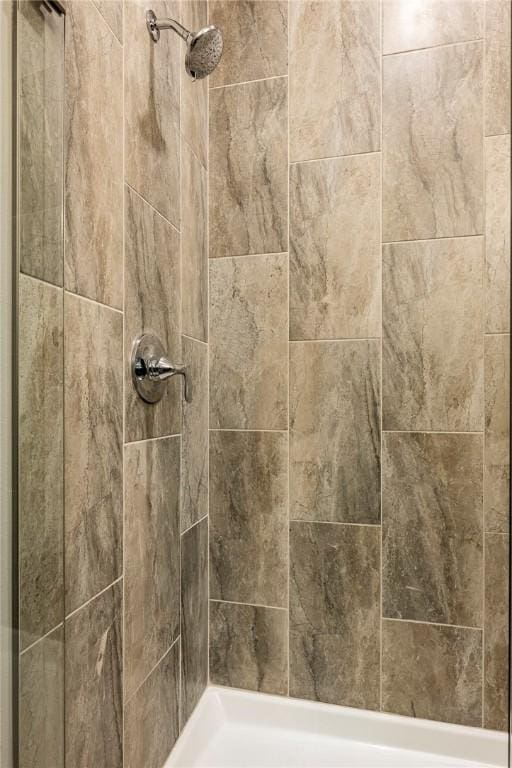 details with a tile shower