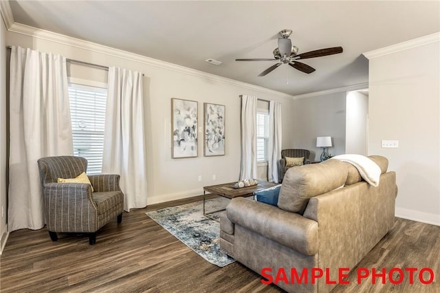 living room featuring a ceiling fan, baseboards, ornamental molding, and wood finished floors