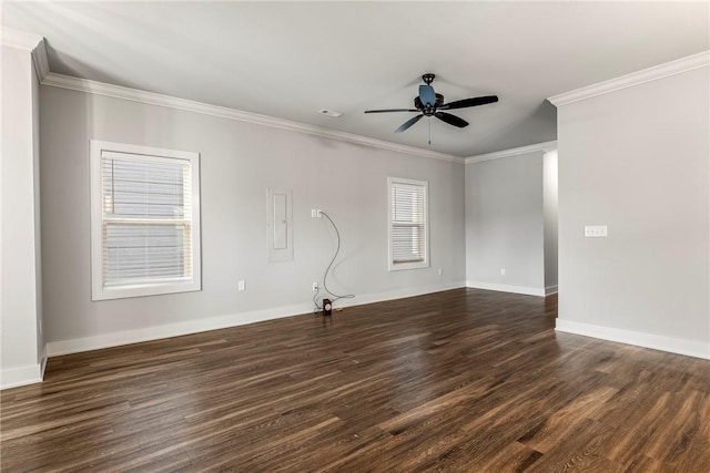 unfurnished living room with dark wood-type flooring, ornamental molding, baseboards, and ceiling fan