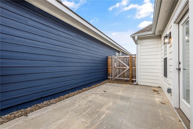 view of patio featuring fence