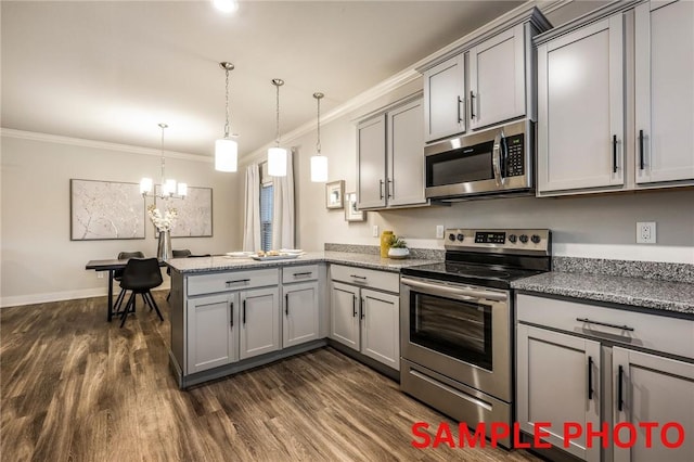 kitchen with dark wood finished floors, a peninsula, gray cabinetry, stainless steel appliances, and crown molding