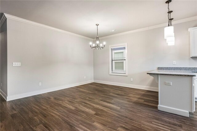 unfurnished dining area with crown molding, dark wood-style floors, and baseboards