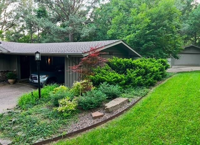 view of home's exterior with aphalt driveway and board and batten siding