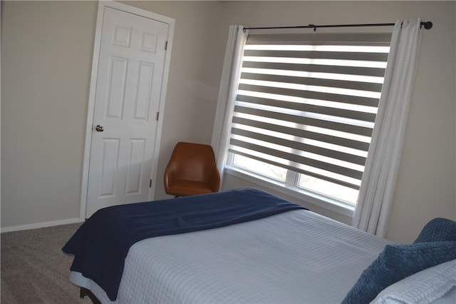 carpeted bedroom with baseboards