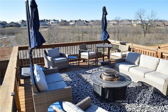 deck with a residential view and an outdoor living space