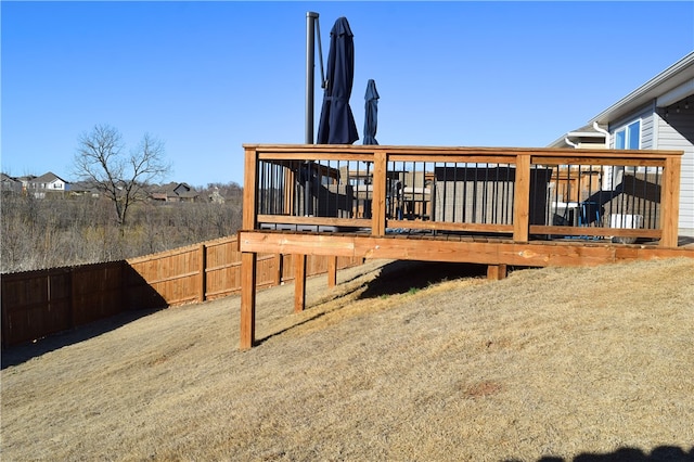 exterior space featuring fence and a wooden deck