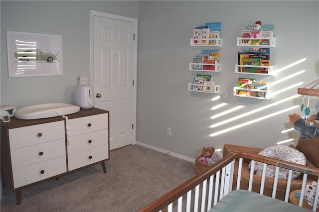 carpeted bedroom featuring baseboards