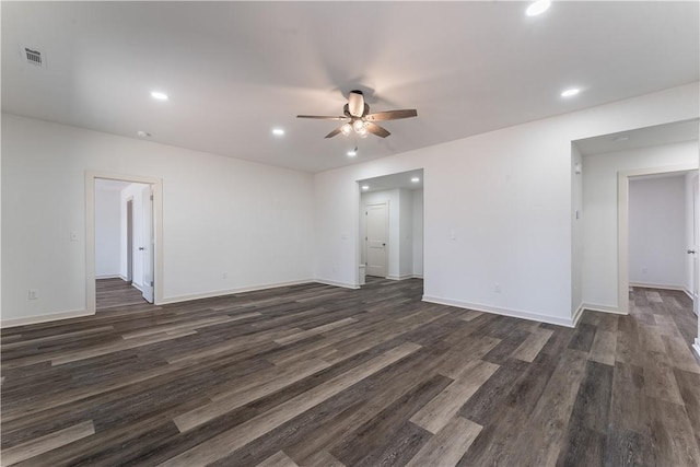 empty room with ceiling fan, recessed lighting, dark wood-style flooring, visible vents, and baseboards