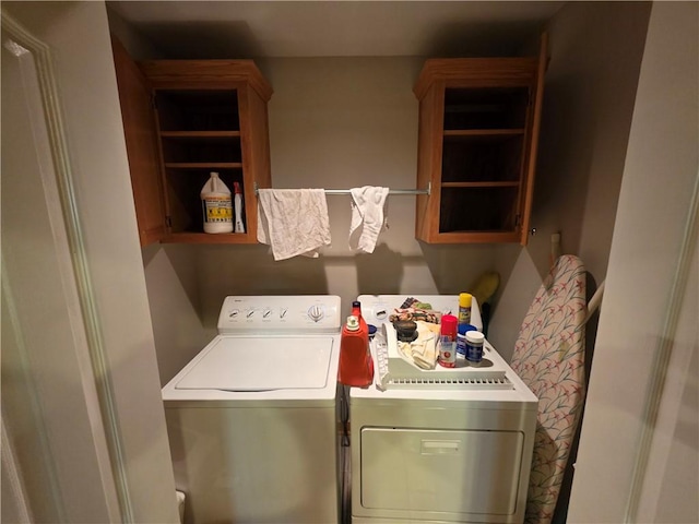 laundry room featuring cabinet space and independent washer and dryer