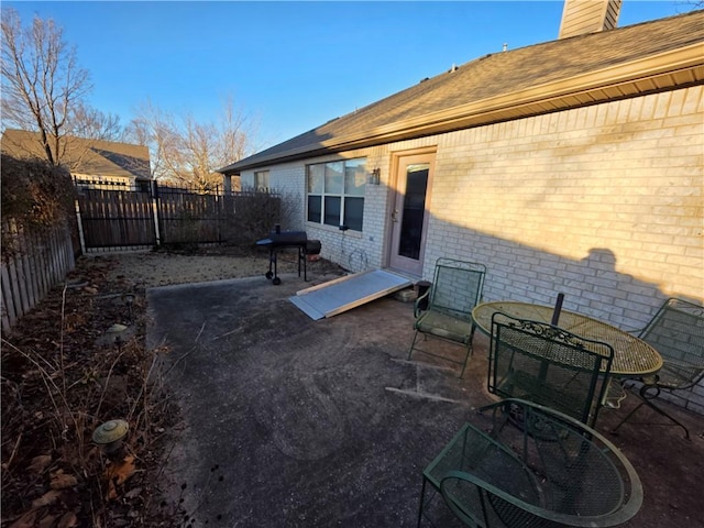 view of patio with a fenced backyard and area for grilling