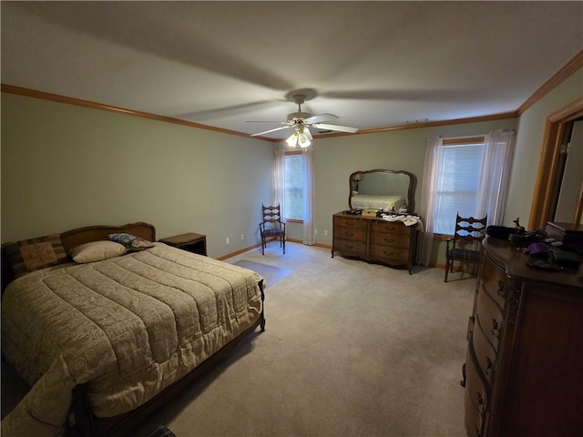 bedroom with ornamental molding, light colored carpet, baseboards, and a ceiling fan