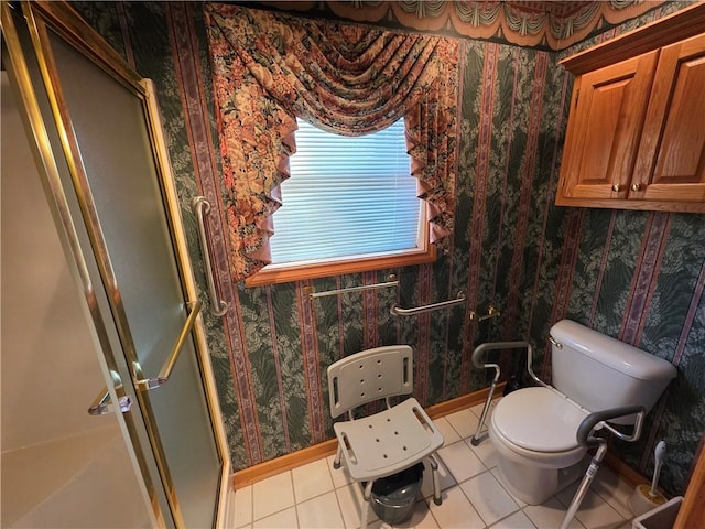 full bathroom featuring wallpapered walls, toilet, a stall shower, baseboards, and tile patterned floors