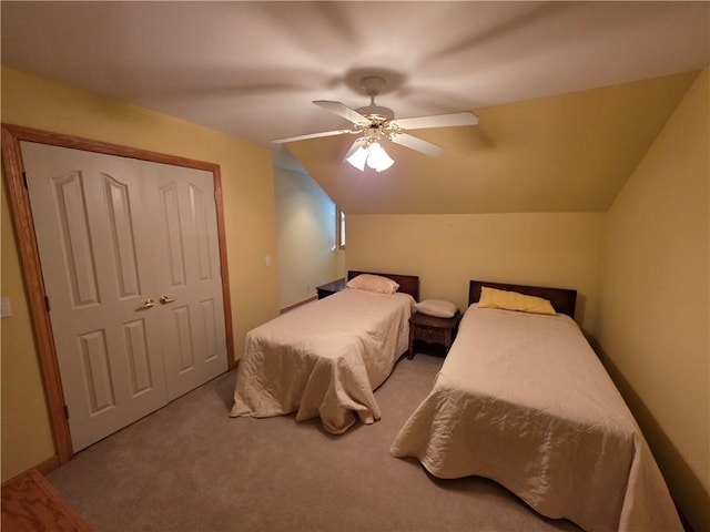 carpeted bedroom featuring lofted ceiling and ceiling fan