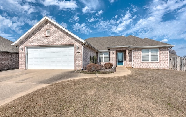 ranch-style home featuring brick siding, roof with shingles, concrete driveway, fence, and a garage