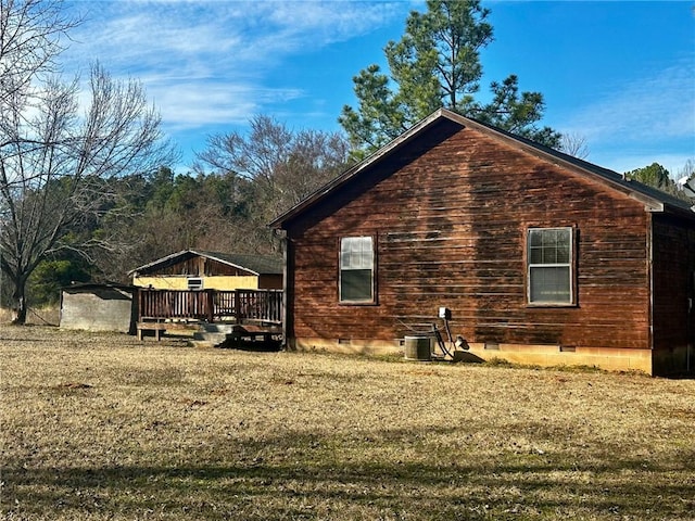 view of property exterior featuring a deck, central AC unit, and crawl space