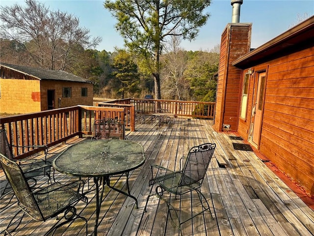 deck featuring outdoor dining area