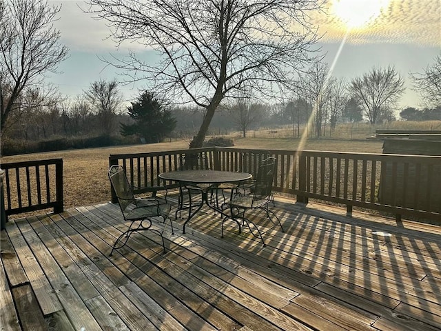 wooden deck with outdoor dining space